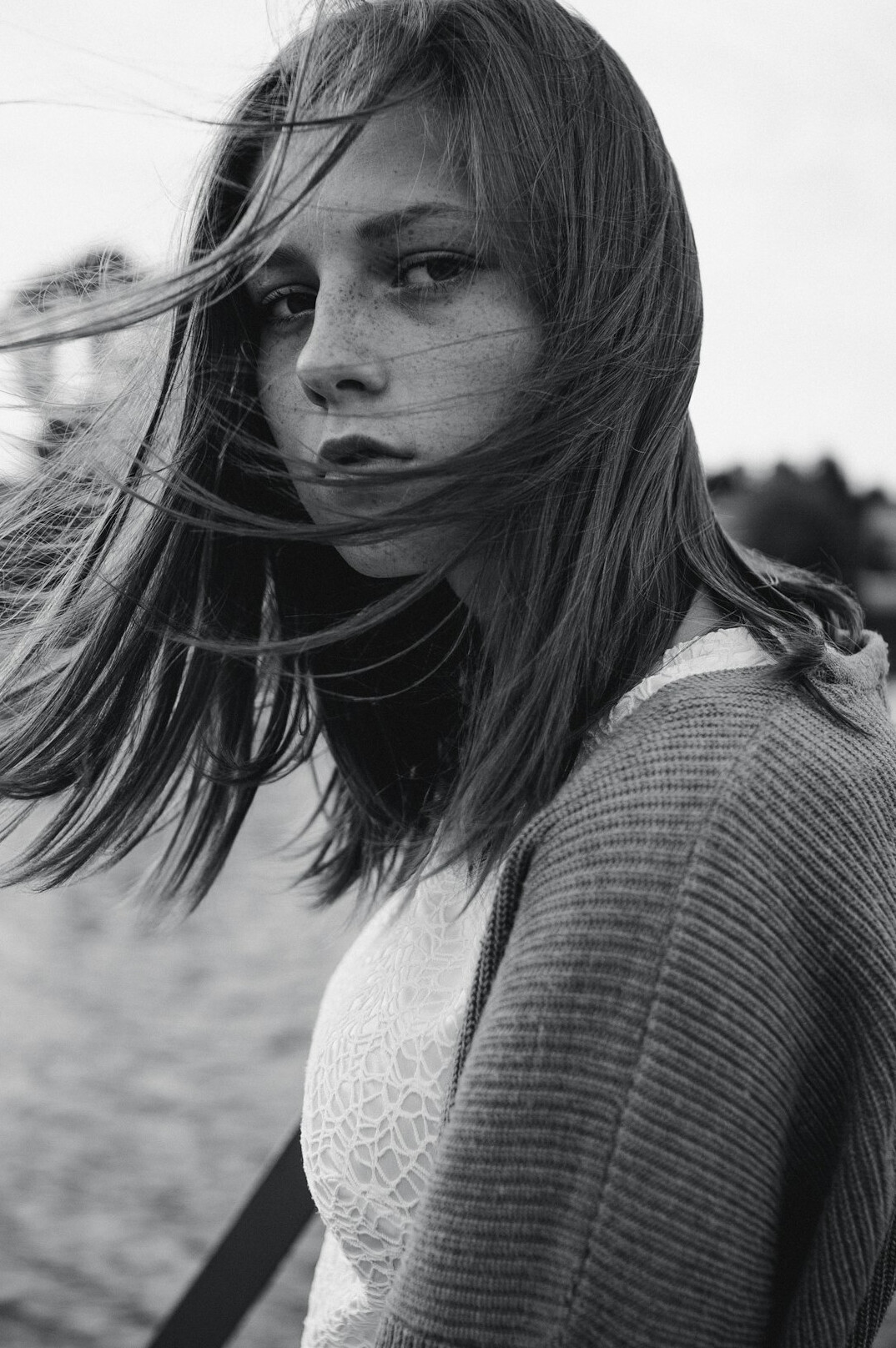 Portrait of a woman with long hair in a cardigan